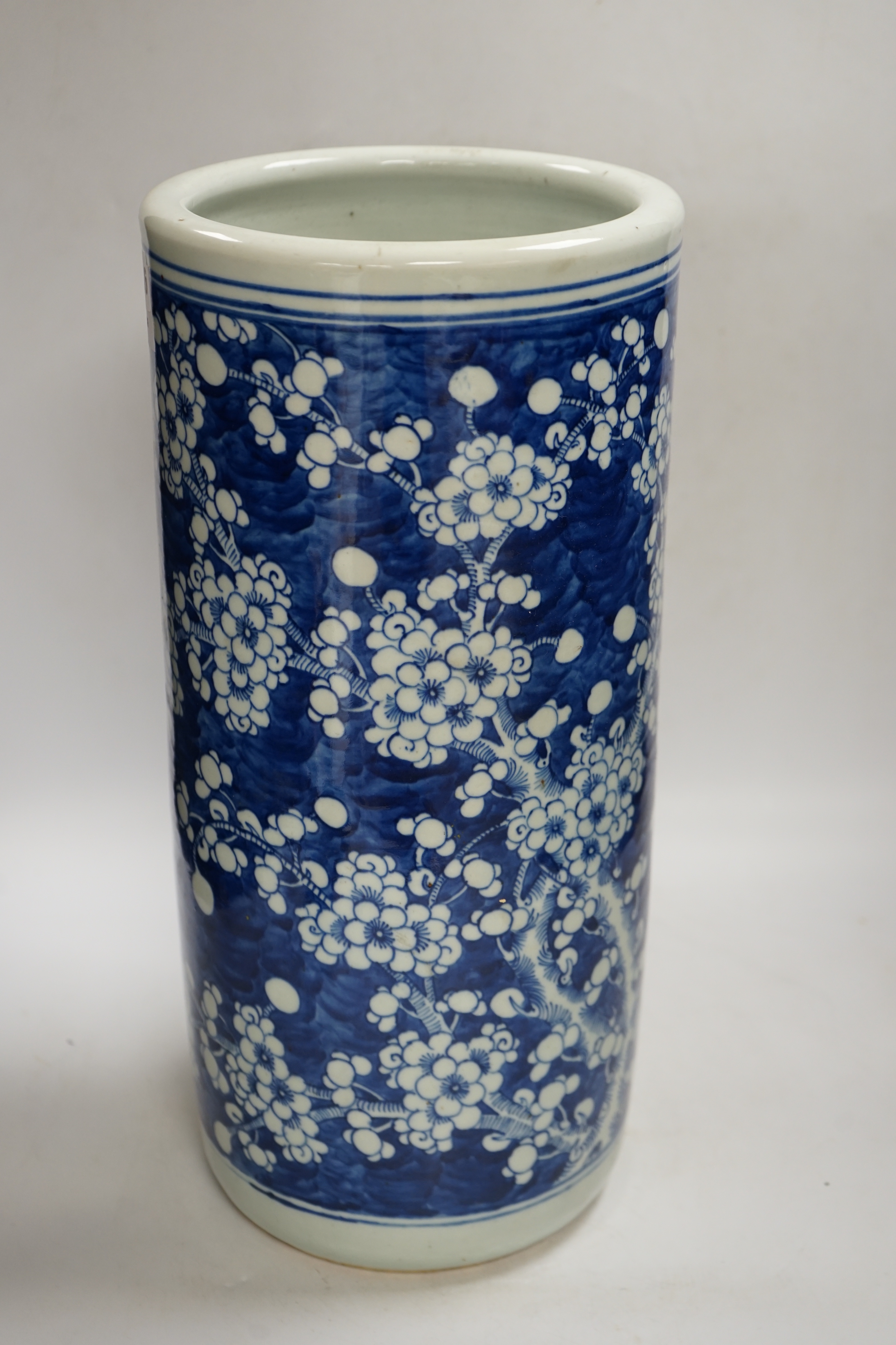 An early 20th century Chinese blue and white prunus stick stand, 44cm